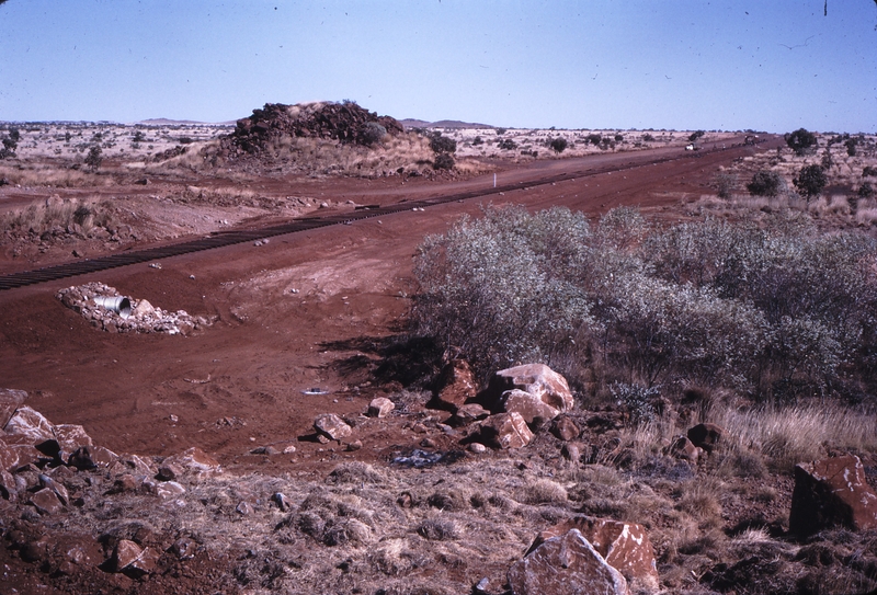 111988: Goldsworthy Railway Shay Gap Extension Mile 108.25 Steel Laying in distance