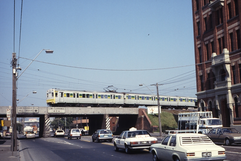 115960: Port Melbourne Line at Clarendon Street Up Suburban 4-car rebuilt Harris 904 M 3504 T leading