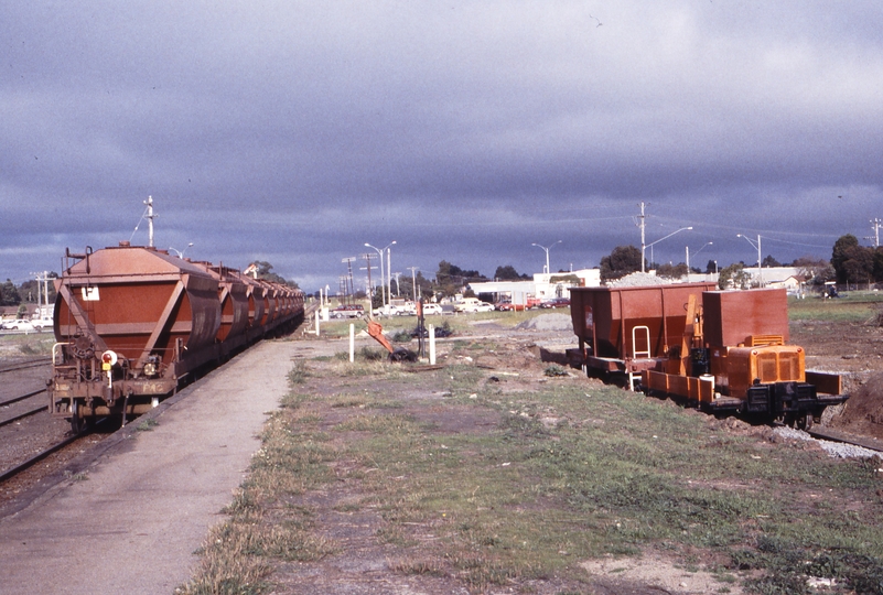 119252: Cranbourne 9409 Down Empty Sand Train T 374. and J Holland Tractor right