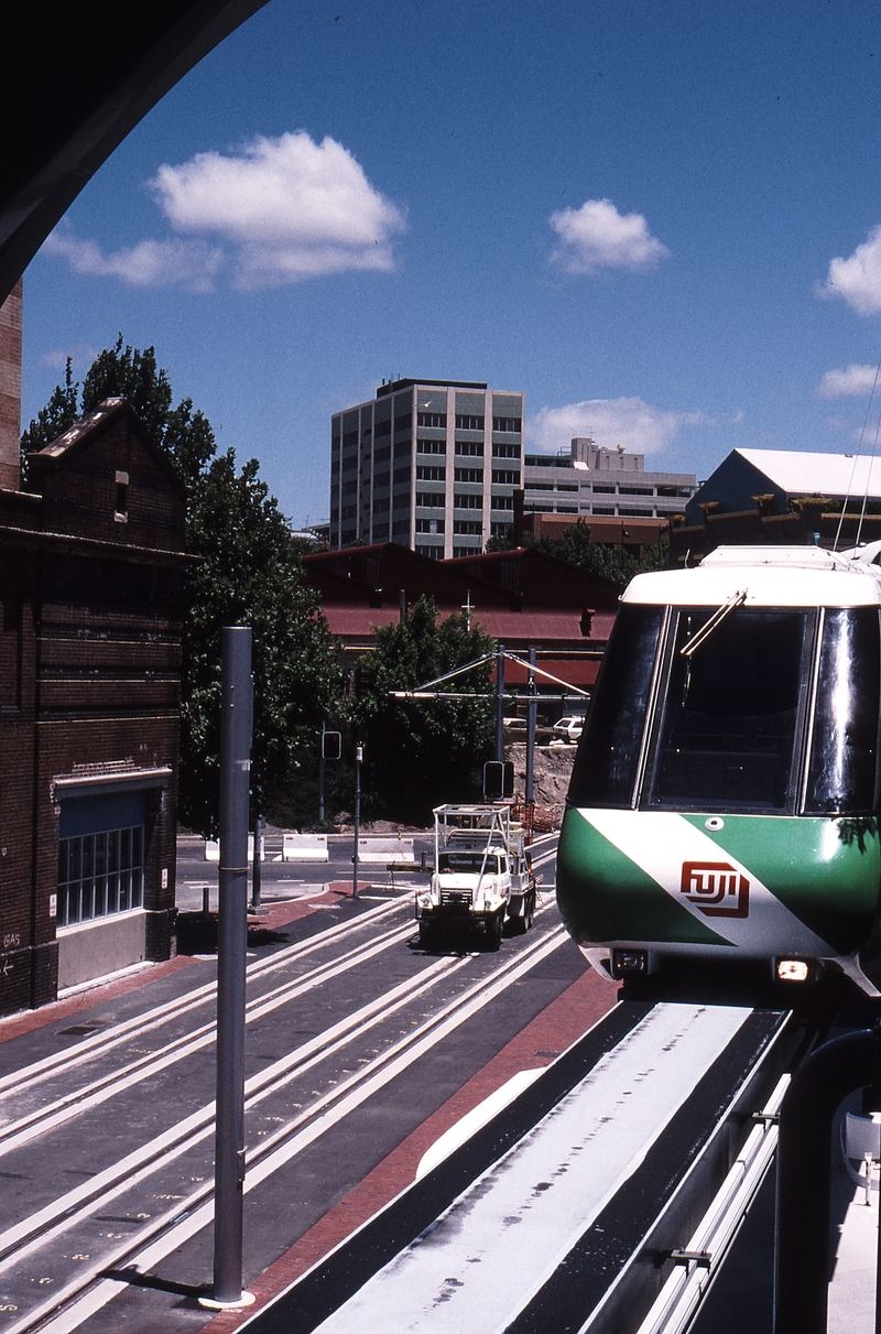 121747: TNT Monorail Haymarket Station Light Rail Tracks in Street below