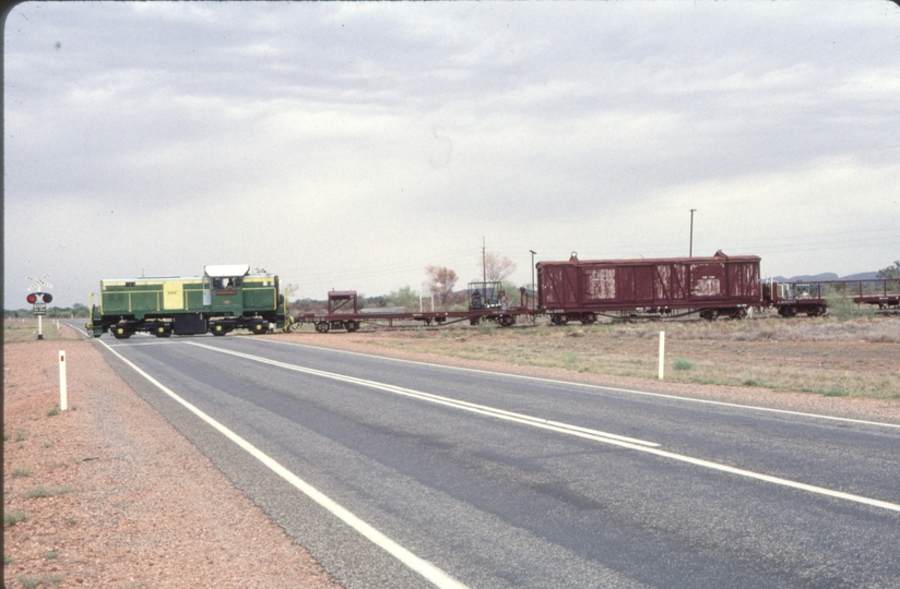 124178: Stuart Highway Level Crossing km 1292 5 Narrow Gauge Central Australia Railway DH 14 10:00am Southbound Passenger