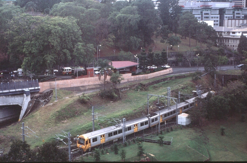 127710: Roma Street Suburban Train Set 249 entering old tunnel viewed from 'Holiday Inn'