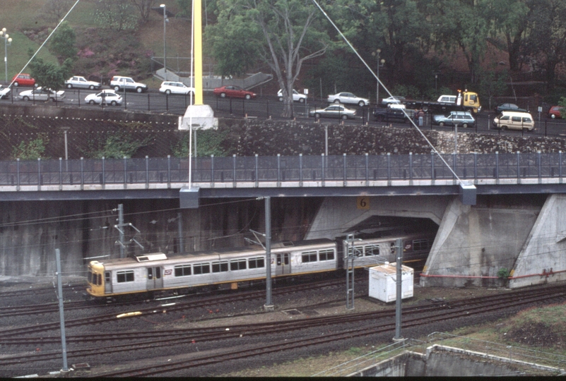 127714: Roma Street Suburban Train entering new tunnel viewed from'Holiday Inn'