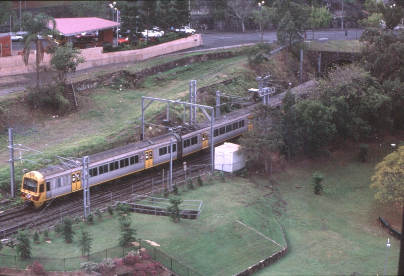 127716: Roma Street Suburban Train entering old tunnel viewed from 'Holiday Inn'