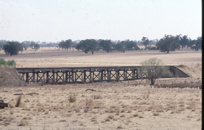 128268: Burrumbuttock (up side), Bridge viewed from South to North across line