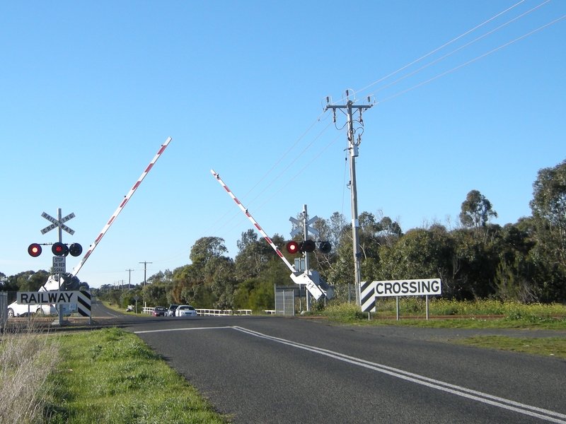 137712: Banks Road Level Crossing viewed from West Side Booms Descending