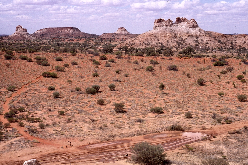 400790: Landforms North of Chambers Pillar NT including 'Weeping Woman' at right