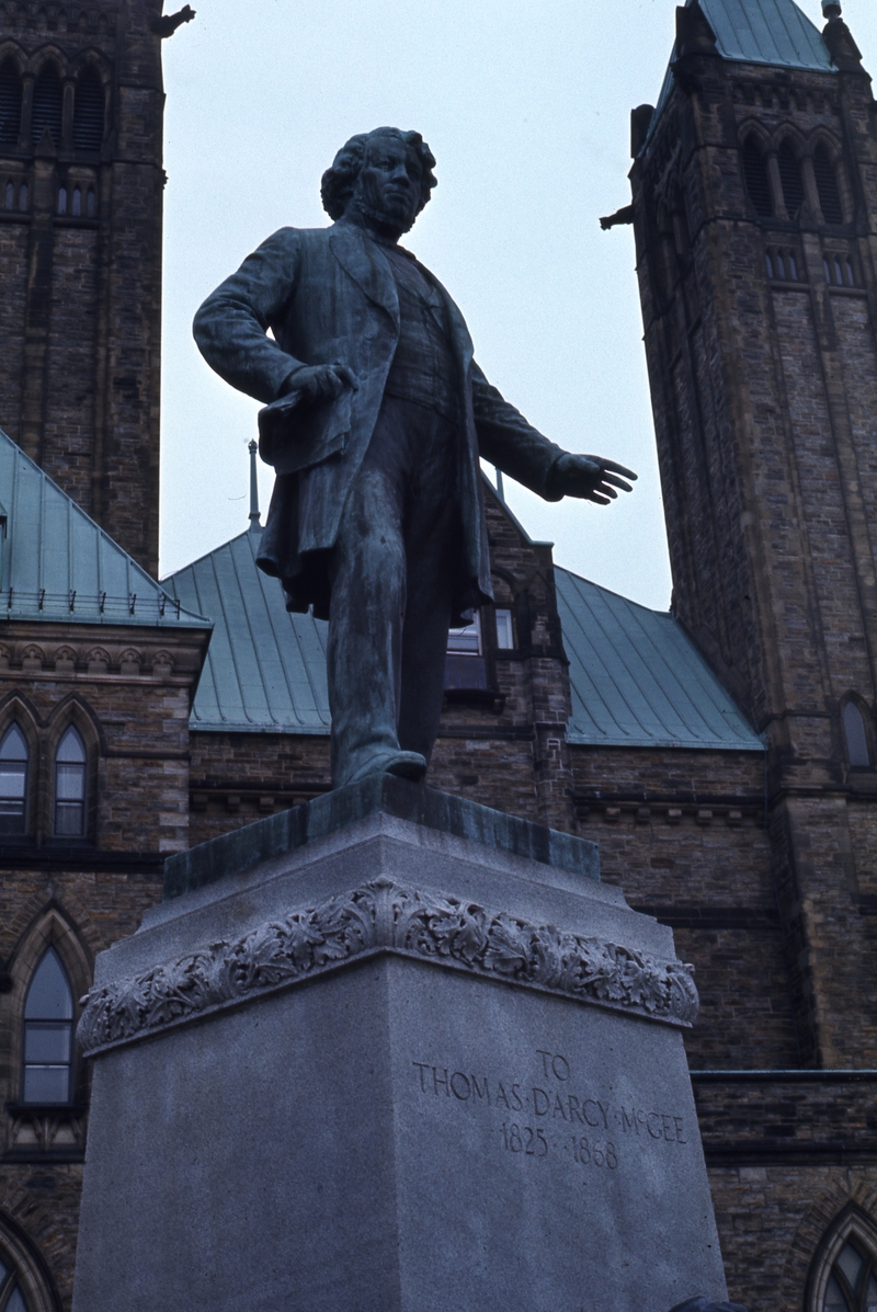 401199: Ottawa ON Canada Statue of Thomas D'Arcy McGee at rear of Houses of Parliament
