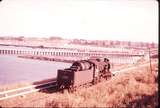 100278: Up Light Engine J 547 Harbour and rail vehicles on pier in background