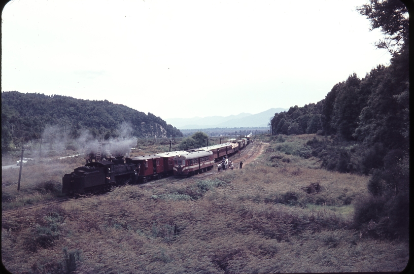 103638: Tawhai Down Mixed A 425 rear end banker and Up Railcar Vulcan