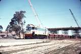 107579: Contract C22 at Welshpool Road Down Ballast J 101 Partly built bridge in background collapsed on Aug. 8 1966