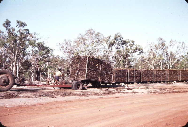 108437: Bambaroo Cane wagon being unloaded on to rails from road vehicle