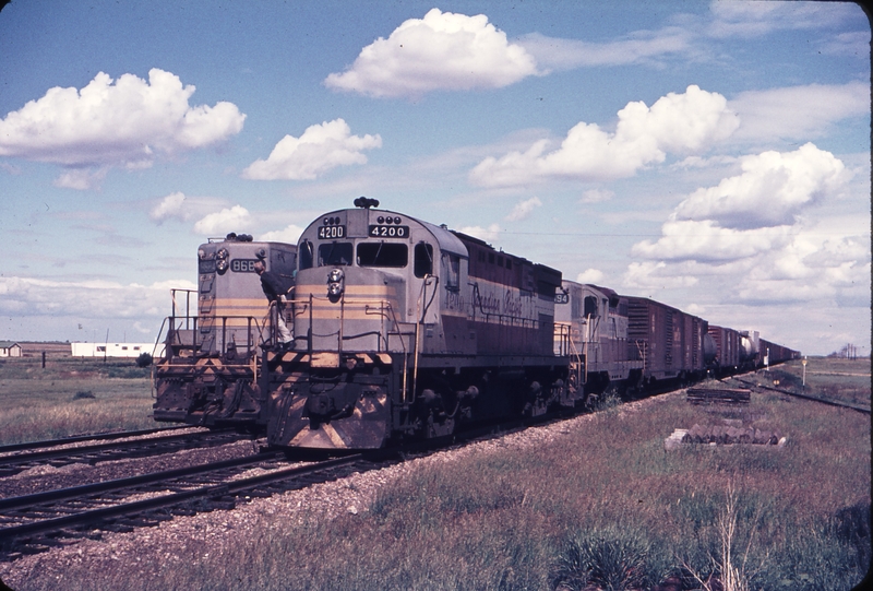 110245: Crowfoot AB 8684 leading Work Extra and Westbound Freight 4200 8494