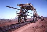 111981: Goldsworthy Railway Shay Gap Extension Mile 97.75 Straddle Crane moving Rails forward No 5 on Steel Train in background