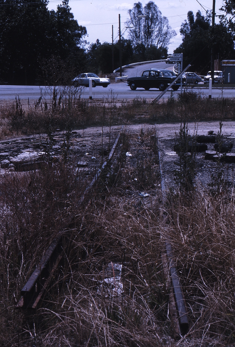 112148: Wangaratta Narrow Gauge Rails at Hume Highway Level Crossing Looking North