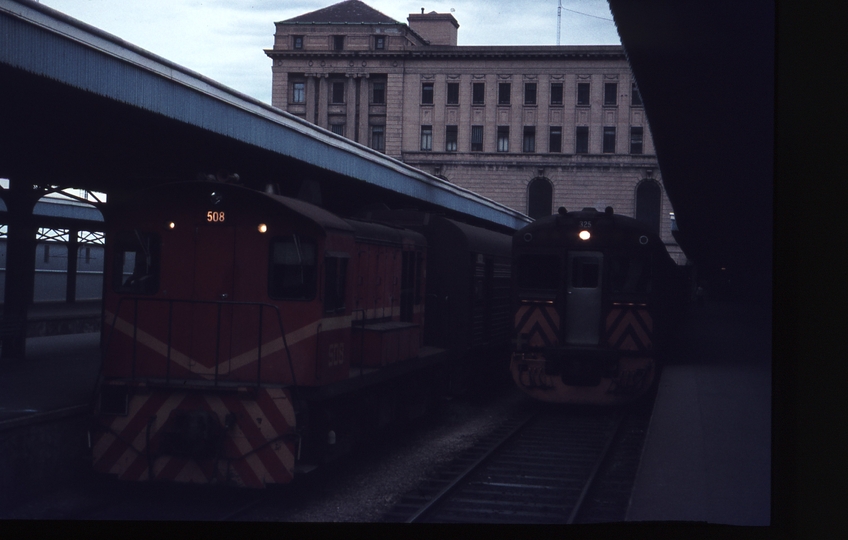 112557: Shunter 508 and 5:10pm North Gawler Suburban 325 leading