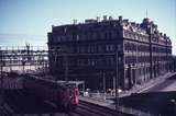 113843: Spencer Street Westbound Suburban 2-car Tait Victorian Railways Administrative Offices in background