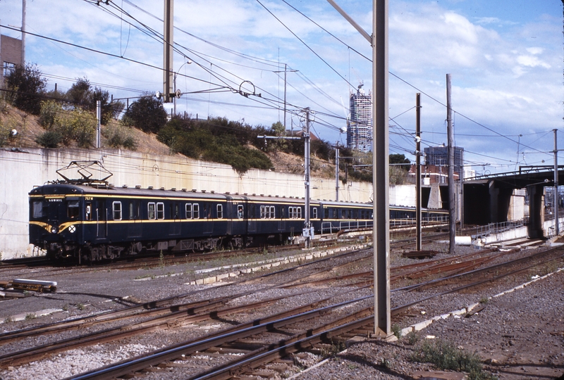 115219: North Melbourne Down Suburban from East ramp 7-car Harris 767 M leading