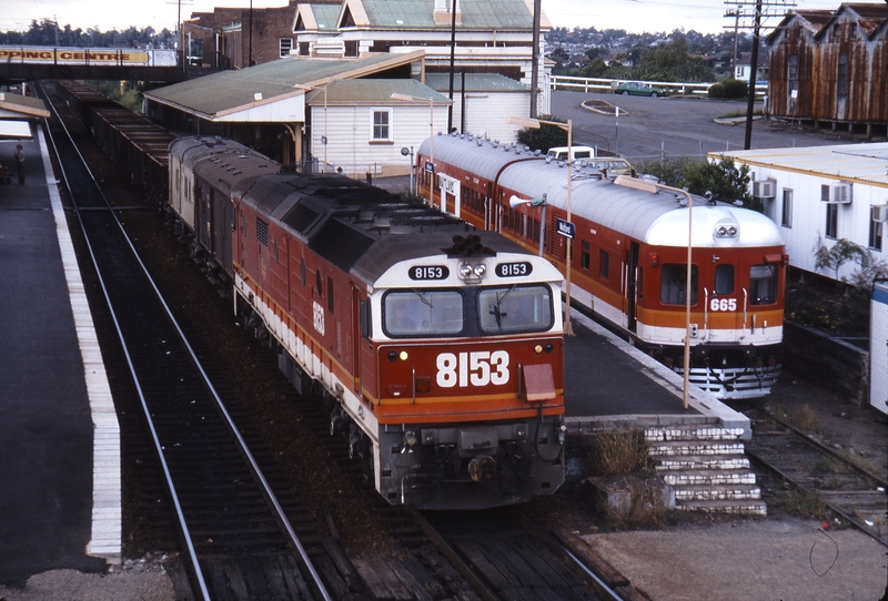 115572: Maitland Up Freight 8153 and Suburban Train 665 nearest