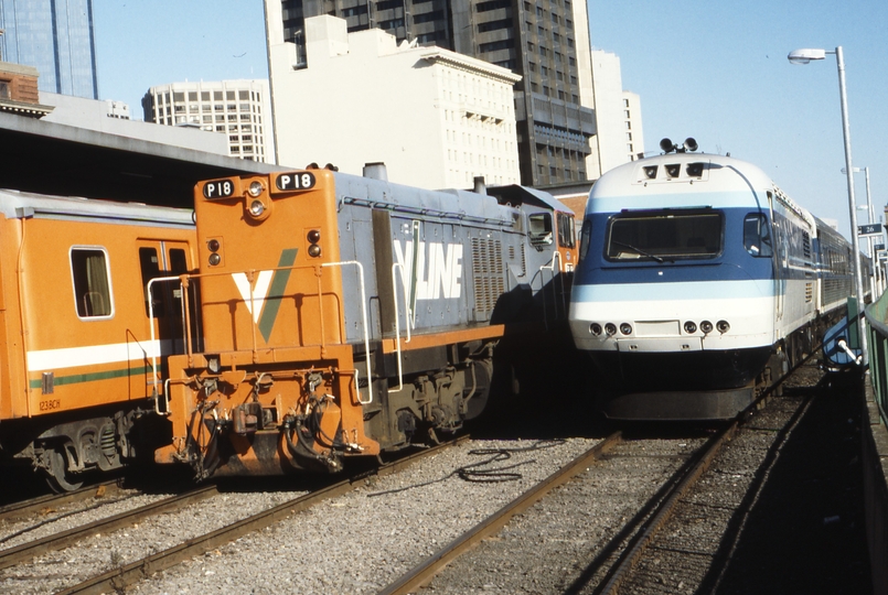 119156: Spencer Street 8323 5:31pm Down Seymour Passenger P 18 and Stabled XPT XP 2018 nearest