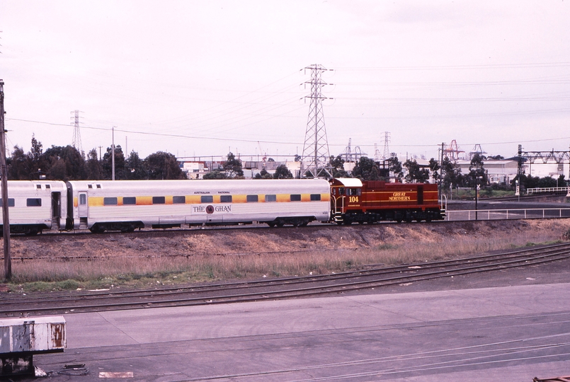 120446: North Melbourne near Contrans Siding 8703 Down Empty Cars J 104 leading