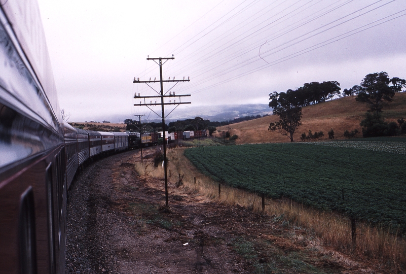 121323: Mount Barker Junction up side km 49.5 Up Overland Express CLP 15 Assisting Up NR Freight