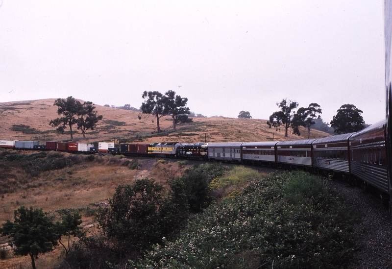 121327: Tunnel down side km 40 Yantaringa Curve Adelaide Hills Up Overland Express CLP 15 assisting Up NR Freight