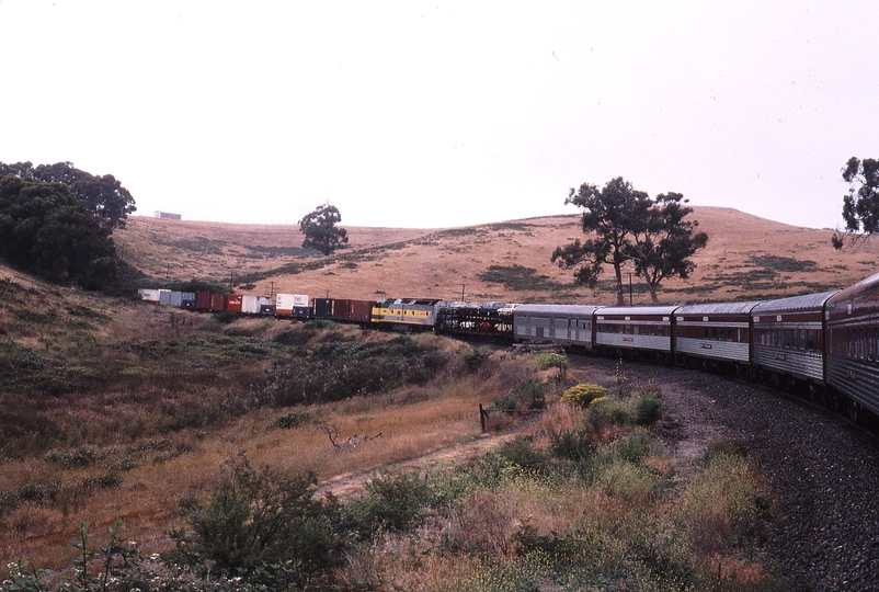 121329: Tunnel down side km 40 Yantaringa Curve Adelaide Hills Up Overland Express CLP 15 assisting Up NR Freight