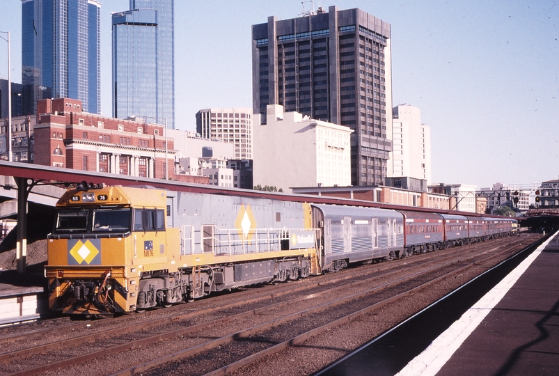 122087: Spencer Street 8704 Overland Empty Cars NR 76 trailing