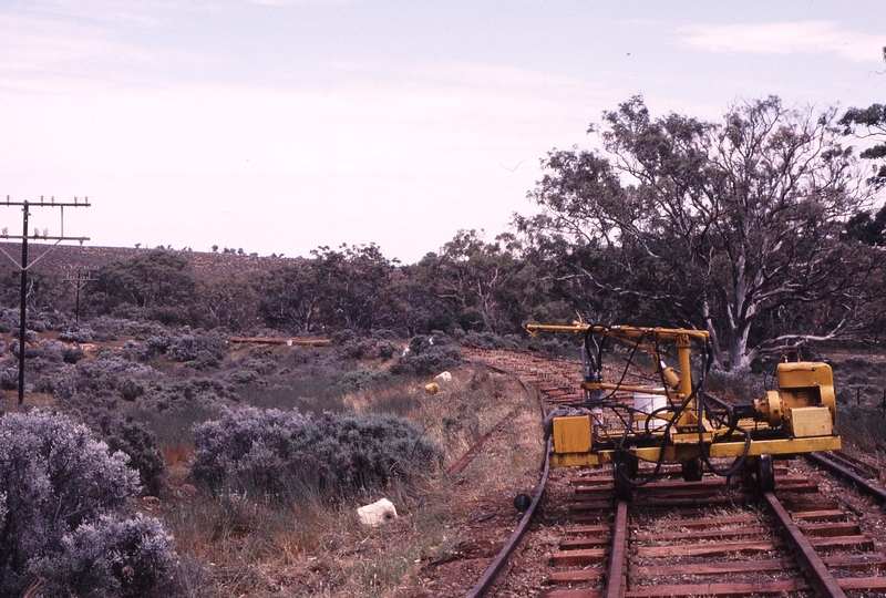 122730: PRR Curve 79 looking South Spike drilling machine