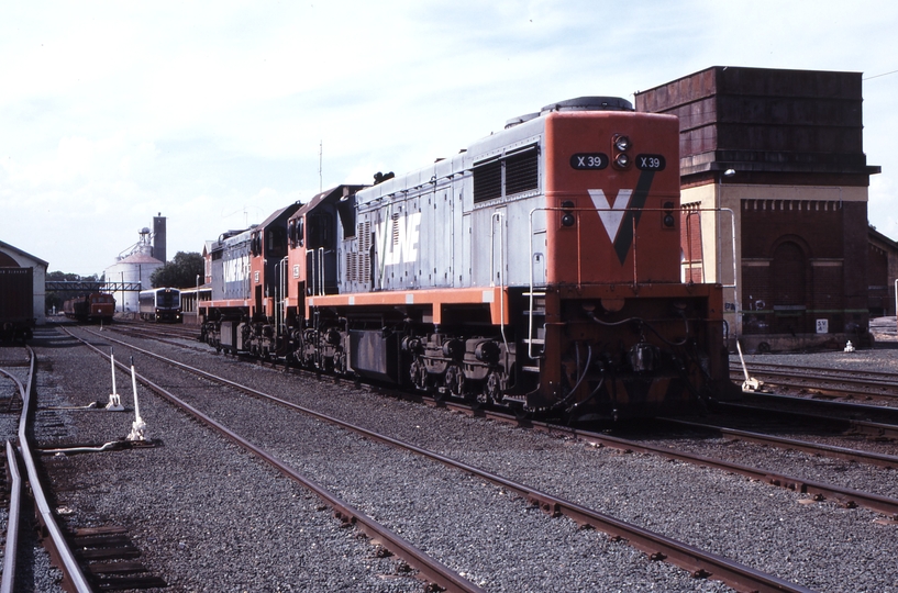 123135: Echuca X 39 X 33 in background 7017 at platform