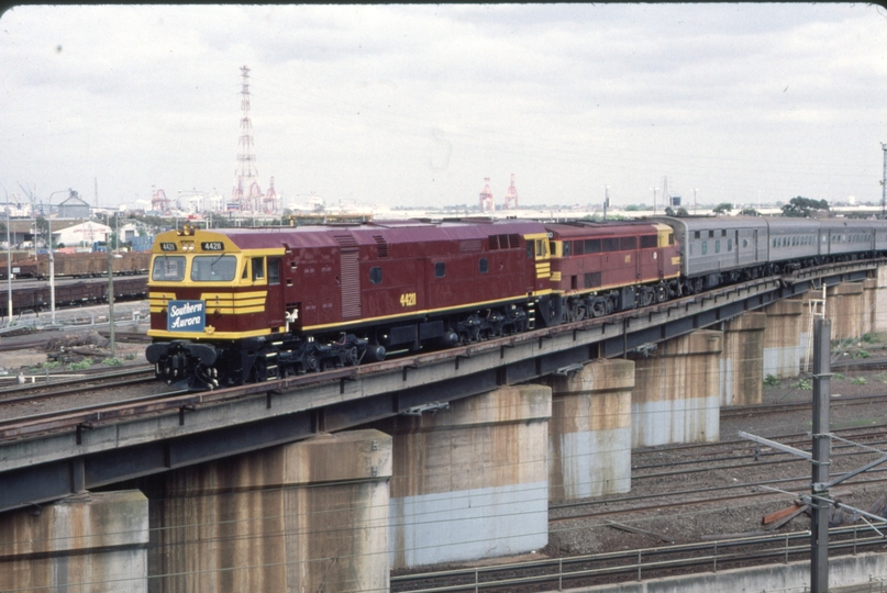 124258: North Melbourne Flyover Empty cars from NSWRTM Southern Aurora 4490 44211 trailing