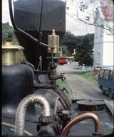 125892: Shantytown view from Light Engine in street towards station