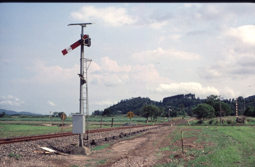 127016: Near Bellenden-Ker Cane tramway grade crossing with North Coast Line looking South