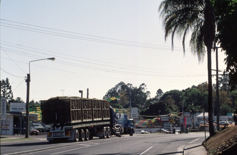 127146: Nambour Mill Howard Street East end Road Vehicle carrying loaded bins