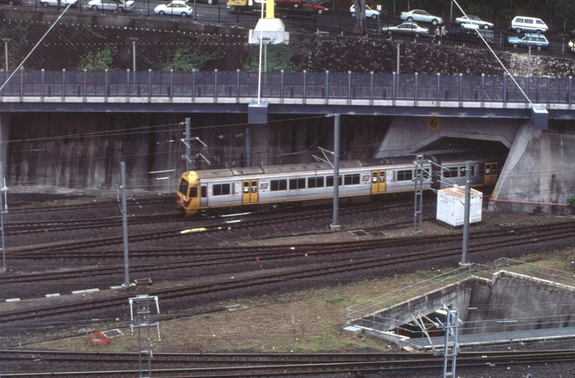 127717: Roma Street Suburban Train entering new tunnel viewed from 'Holiday Inn'