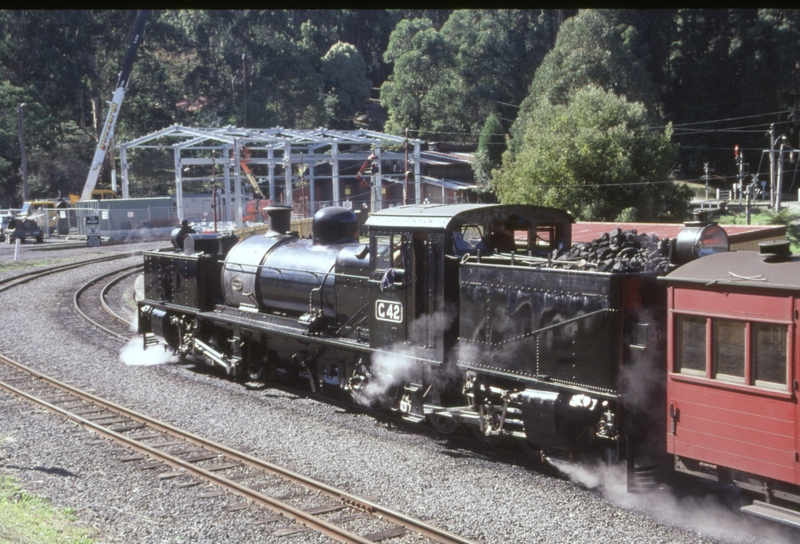 129665: Belgrave No 19 Down Passenger G 42 Workshop extension in background