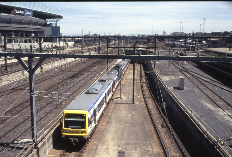 130133: Spencer Street 899 M leading 6-car X'Trapolis Suburban emerging from Burnley Lines Tunnel