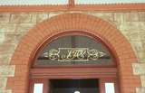 130297: Sulphide Street Station Silverton Tramway Monogram over entrance to booking lobby