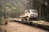 131272: Lower Landing Loading Forestry Tasmania Road Vehicles on to Goods Train