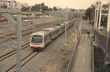 132949: Perth Milligan Street Footbridge looking West Suburban from Fremantle 4-car A Set 304 leading