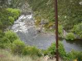 136008: km 30 Otago Central Railway Abandoned 4-wheel wagon in river bed