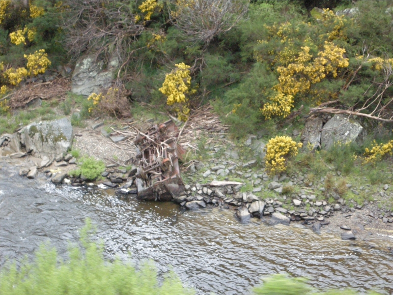 136019: km 30 Otago Central Railway abandoned 4-wheel wagon in river bed