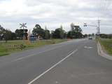 136526: km 48 1 South Gippsland Railway Berwick Cranbourne Road Level Crosing looking East along Road