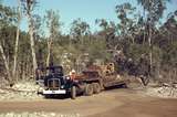 400114: Groote Eylandt NT BHP Alyangula Gorge Quarry Unloading traxcavator from AEC lowloader