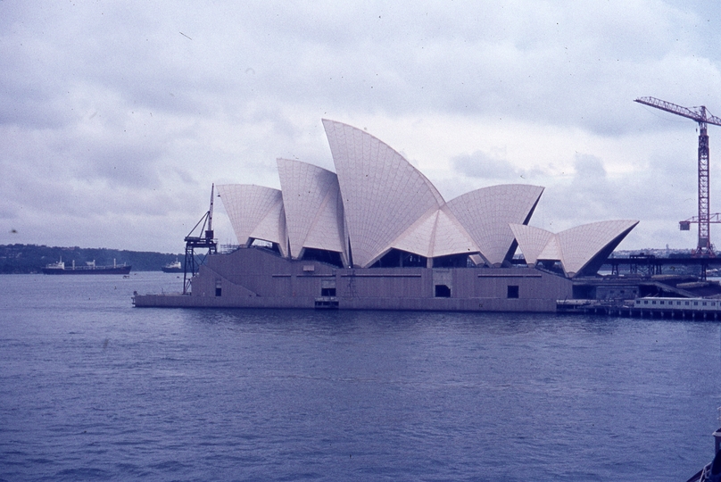 400225: Sydney NSW Opera House under construction viewed from 'Canberra' departing